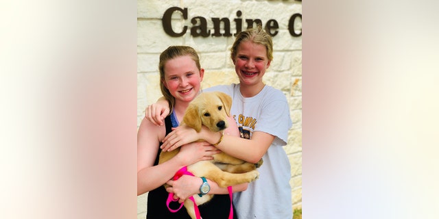 The Texas mom was inspired to train a service dog so her daughters could "experience giving back to the community" in a tangible way.
