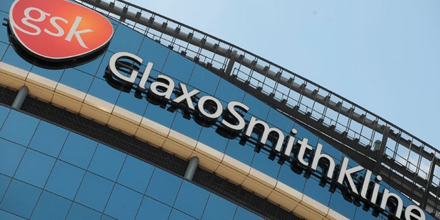 Signage is pictured on the company headquarters of GlaxoSmithKline in west London July 21, 2008. GlaxoSmithKline announce their half yearly results on Wednesday July 23. REUTERS/Toby Melville (BRITAIN) - RTR20E8O