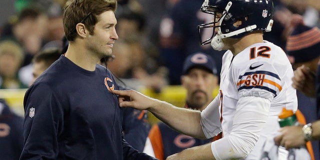 Chicago Bears quarterback Josh McCown (12) talks to Jay Cutler during the first half of an NFL football game against the Green Bay Packers Monday, Nov. 4, 2013, in Green Bay, Wis. (AP Photo/Mike Roemer)
