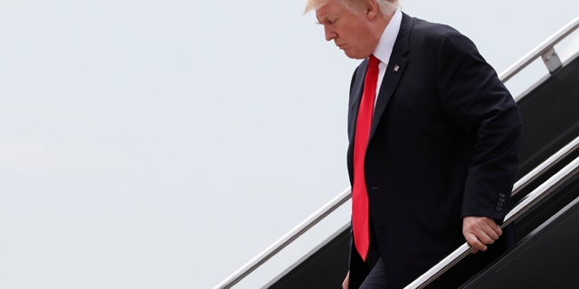 President Donald Trump arrives on Air Force One at Dulles International Airport in Dulles, Va., Saturday, July 22, 2017, after attending the commissioning ceremony of the aircraft carrier USS Gerald R. Ford (CVN 78) at Naval Station Norfolk, Va. (AP Photo/Carolyn Kaster)