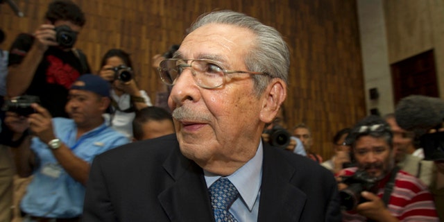 FILE - In this Friday, May 10, 2013 file photo, Guatemala's former dictator Jose Efrain Rios Montt wears headphones as he listens to the verdict in his genocide trial in Guatemala City.