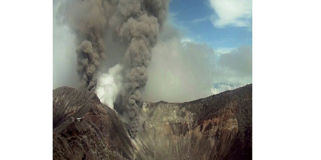 May 21, 2013: In this image provided by the Volcanological and Seismological Observatory of Costa Rica, the Turrialba volcano emits an ash-filled gas plume in Costa Rica.