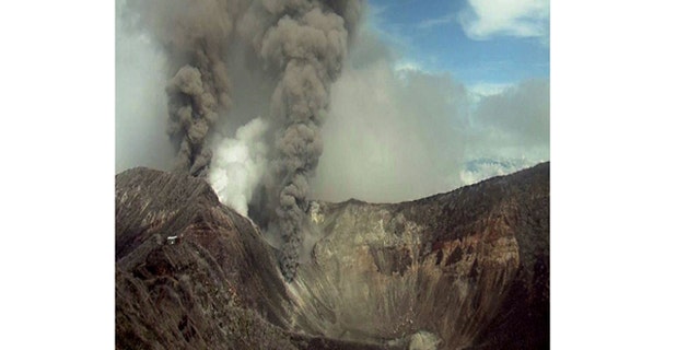 May 21, 2013: In this image provided by the Volcanological and Seismological Observatory of Costa Rica, the Turrialba volcano emits an ash-filled gas plume in Costa Rica.