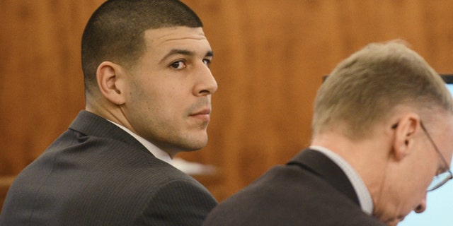 Aaron Hernandez, left, sits with his attorney Charles Rankin during his trial at Bristol Superior Court on Wednesday, Feb. 11, 2015 in Fall River, Mass. (AP Photo/The Boston Herald, Ted Fitzgerald, Pool)