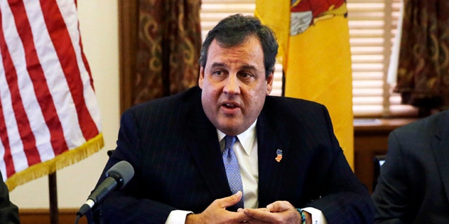 New Jersey Gov. Chris Christie, center, meets with members of his Cabinet at the Statehouse in Trenton, N.J., Tuesday, Nov. 12, 2013. (AP Photo/Mel Evans)