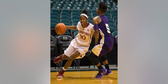 Stanford guard Briana Roberson (10) drives past Prairie View A&M Shaneece Stephens during the first half of an NCAA college basketball game, Sunday, Nov. 30, 2014 in Honolulu. (AP Photo/Marco Garcia)