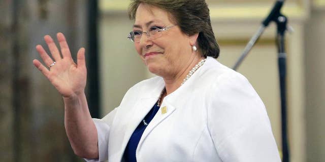 Chile's President Michelle Bachelet waves as she arrives for the inauguration ceremony of Argentina's new President Mauricio Macri at the government house, in Buenos Aires, Argentina, Thursday, Dec. 10, 2015. Macri, the former mayor of Buenos Aires who hails from one of Argentina's richest families, took the oath of office in Congress in front of legislators, several Latin American heads of state and other dignitaries. (AP Photo/Victor R. Caivano)