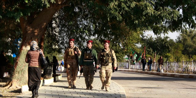 Dec. 18, 2012: Iraqi Presidential guards walk outside the hospital where Iraqi president Jalal Talabani is receiving treatment at the Medical City in Baghdad, Iraq.