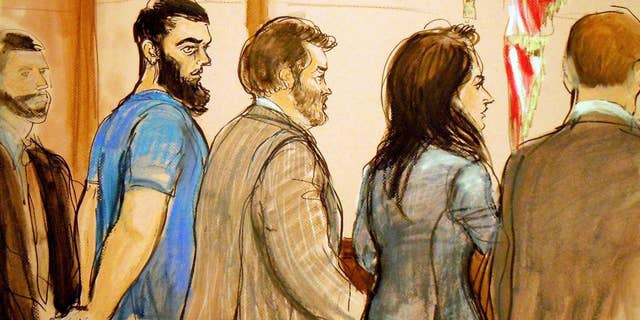 FILE - In this Jan. 7, 2013 file image, Abid Naseer, second from left, is arraigned in Brooklyn Federal Court where he pleaded not guilty through his attorney Steven Brounstein, center, to terrorism charges in an alleged al-Qaida plot against the New York City subways. Second from right is Assistant U.S. Attorney Zainab Ahmad. Naseer is expected to give an opening statement Tuesday, Feb. 17, 2015, in federal court in New York City. (AP Photo/Elizabeth Williams, File)