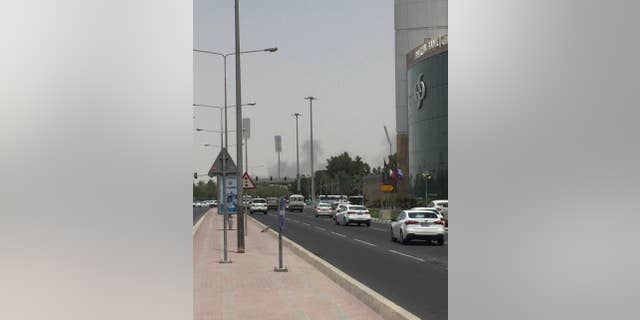This picture posted on social media shows thick black smoke billowing from the Tawar Mall complex, Wednesday, July 20, 2016. Authorities say a fire has broken out at a shopping mall under construction in the country’s capital, the second such blaze in the 2020 World Cup host nation in less than four months. The Ministry of Interior said firefighters had contained the fire near the Dahl al-Hamam park. No casualties were reported. (Haris Aghadi Twitter via AP)