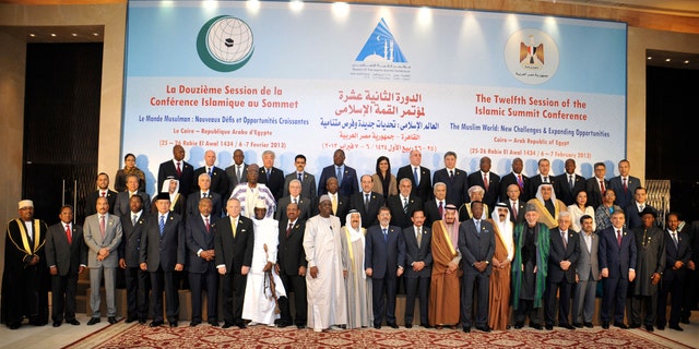 Feb. 6, 2013: In this photo released by the Egyptian Presidency, leaders of nations taking part in the Organization of Islamic Cooperation's two-day summit, which brings together leaders from across the Muslim world, pose for a group photograph in Cairo, Egypt.