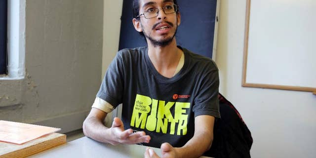 Samuel Santaella, 23, from the Queens borough of New York, speaks during an interview the offices of Riders Alliance, in New York, Wednesday, Nov. 30, 2016. The Riders Alliance, a commuter advocacy group, along with the anti-poverty group Community Service Society of New York, has been calling on Democratic Mayor Bill de Blasio to include an estimated $200 million in the city’s preliminary budget plan this January that would help pay for discounted subway and bus rides. (AP Photo/Richard Drew)