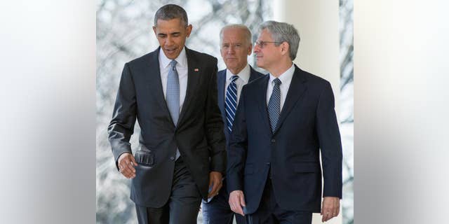 In this photo taken March 16, 2016, Federal appeals court judge Merrick Garland arrives with President Barack Obama and Vice President Joe Biden to be introduced as Obama’s nominee for the Supreme Court, during an announcement in the Rose Garden of the White House. Garland is now under consideration to be Biden's attorney general, causing worries by some on the left that it may be difficult to replace him with a GOP-controlled Senate. (AP Photo/Andrew Harnik, File)
