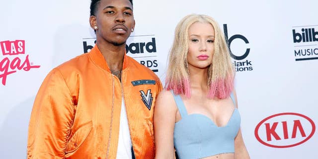 FILE - In this May 17, 2015 file photo, Nick Young, left, and Iggy Azalea arrive at the Billboard Music Awards at the MGM Grand Garden Arena in Las Vegas. Young proposed to the rapper late Monday, June 1, as they celebrated Young's 30th birthday. Azalea announced the couple's break up on social media Sunday, June 19, 2016. (Photo by Eric Jamison/Invision/AP, File)