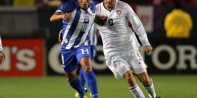 CARSON, CA - JANUARY 23: Ramon Nunez #10 of Honduras holds off a challenge by Conor Casey #9 of USA during their international friendly match on January 23, 2010 in Carson, California. Honduras defeated USA 3-1. (Photo by Victor Decolongon/Getty Images)