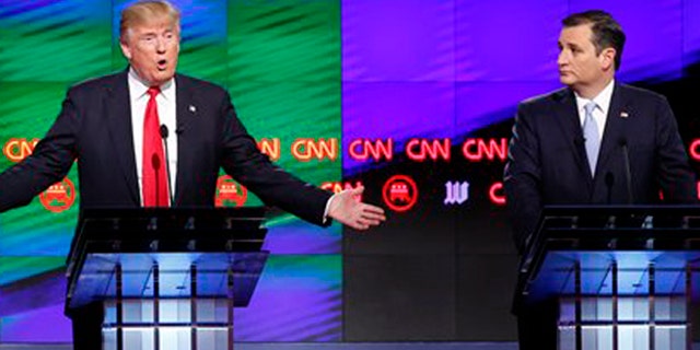 Republican presidential candidate, businessman Donald Trump answers a question, as Republican presidential candidate, Sen. Ted Cruz, R-Texas, , listens, during the Republican presidential debate sponsored by CNN, Salem Media Group and the Washington Times at the University of Miami, Thursday, March 10, 2016, in Coral Gables, Fla. (AP Photo/Wilfredo Lee)