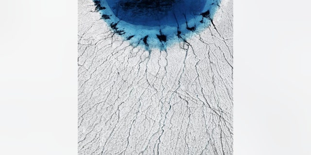 Greenland's lakes are draining away in hours, thanks to a vast network of fissures hidden on the ice sheet below. (Credit: Timo Lieber)