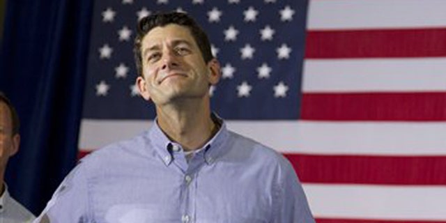 FILE: June 18, 2012: GOP Rep. Paul Ryan, R-Wis., at a campaign event with GOP presidential candidate Mitt Romney in Janesville, Wis.