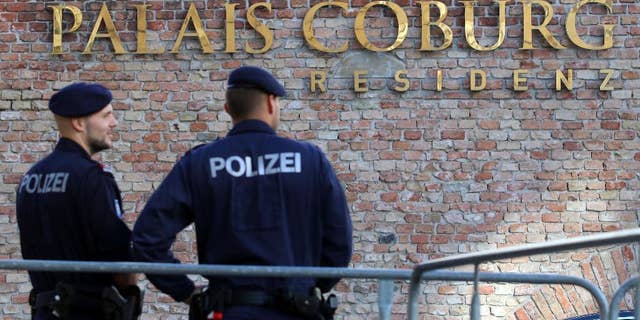Police guard in front of Hotel Palais Coburg during closed-door nuclear talks in Vienna, Austria, Thursday, Oct. 16, 2014. EU foreign policy chief Catherine Ashton and Iranian Foreign Minister Mohammad Javad Zarif continue their nuclear talks in an effort to meet the target date of Nov. 24., but with less than six weeks left, there may be no alternative than to prolonging them. (AP Photo/Ronald Zak)
