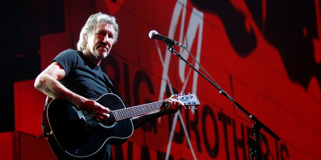 FILE - In this April 1, 2011 file photo, Roger Waters performs during his "The Wall Tour 2010/2011" in Milan, Italy. Now that his three-year world tour for “The Wall” has finally come to an end, Waters wants to set the record straight over criticism he’s received from Jewish groups regarding his use of the Star of David symbol in the show and his support for a cultural boycott of Israel. (AP Photo/Antonio Calanni, File)