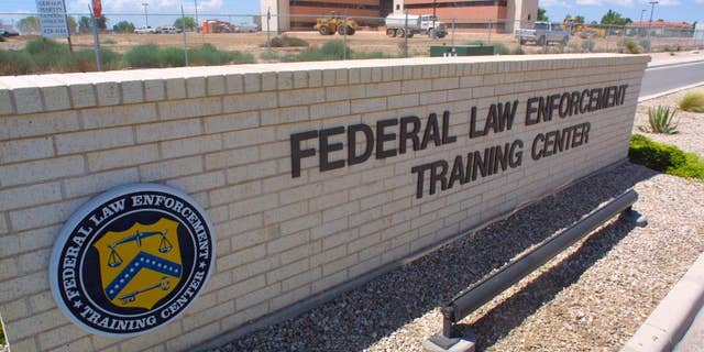 FILE - In this Aug. 1, 2002 file photo, the Federal Law Enforcement Training Center in Artesia, N.M., where agents for the Federal Air Marshal Service undergo training. Incidents of unruly passengers on planes are increasing, and more effective deterrents are needed to tackle the problem, a global airline trade group said Wednesday, Sept. 28, 2016. There were 10,854 air rage incidents reported by airlines worldwide last year, up from 9,316 incidents in 2014, according to the International Air Transport Association. That equates to one incident for every 1,205 flights, an increase from one incident per 1,282 flights the previous year. (AP Photo/J.R. Hernandez, File)