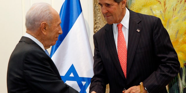 U.S. Secretary of State John Kerry shakes hands with Israeli President Shimon Peres in Jerusalem, Israel, Thursday, May 23, 2013. The US and Israel raised hopes Thursday for a restart of the Middle East peace process, despite little tangible progress so far from Kerry's two-month-old effort to get Israelis and Palestinians back to the negotiating table. (AP Photo/Jim Young, Pool)