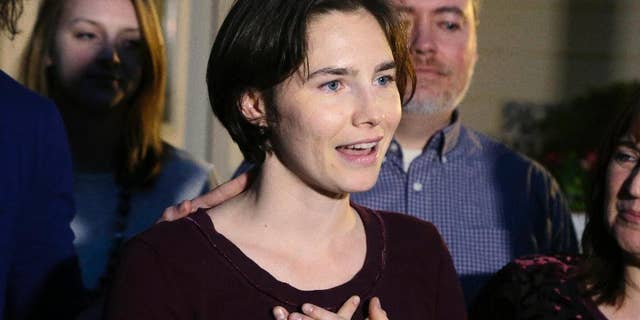 FILE - In this Friday, March 27, 2015 file photo, Amanda Knox talks to members of the media outside her mother's home in Seattle. The European Court of Human Rights has agreed to hear Amanda Knox's case challenging her slander conviction during the trial for her British roommate's 2007 murder, her Italian defense lawyer said Friday, May 20, 2016. Dalla Vedova said the Strasbourg court's decision this week is "good news" for his client, because the vast majority of cases are rejected at the preliminary stage. The Italian government has until September to provide its response. (AP Photo/Ted S. Warren, file)