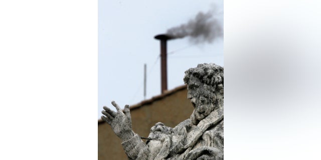 FILE - In this April 19, 2005 file photo, black smoke billows from the chimney atop the Sistine Chapel at the Vatican, indicating that the cardinals gathered in the Conclave for the second consecutive day have not yet chosen the new pontiff. White smoke signals that cardinals have chosen a pope and he has accepted. The Vatican announced Monday, Feb. 11, 2013 that Pope Benedict XVI, who was elected pope in the 2005 conclave, is stepping down on Feb. 28, becoming the first pontiff in 600 years to resign. The conclave to elect a new pope must begin 15-20 days after Benedict's resignation. (AP Photo/Diether Endlicher, File)