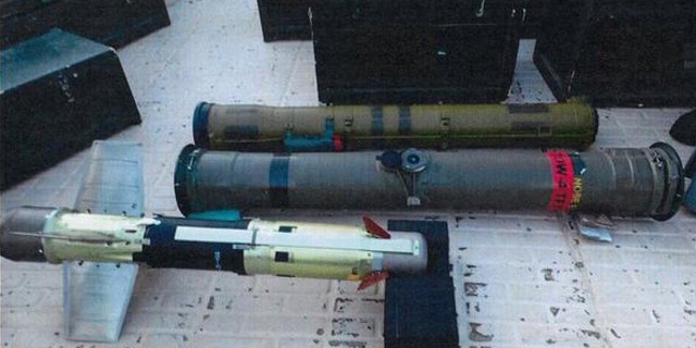 In this image posted on the official Twitter account of the Saudi Press agency, SPA, Tuesday, Sept. 30, 2015, confiscated weapons are seen aboard an Iranian fishing boat bound for Yemen. The Saudi-led coalition battling Yemen's Shiite rebels says it has foiled an attempt by Iran to smuggle missiles and other weapons to the rebels aboard a fishing boat. The coalition says in a statement released Wednesday that the seizure took place on Saturday some 241 kilometers (150 miles) southeast of the Omani port of Salalah. (Saudi Press Agency via AP)