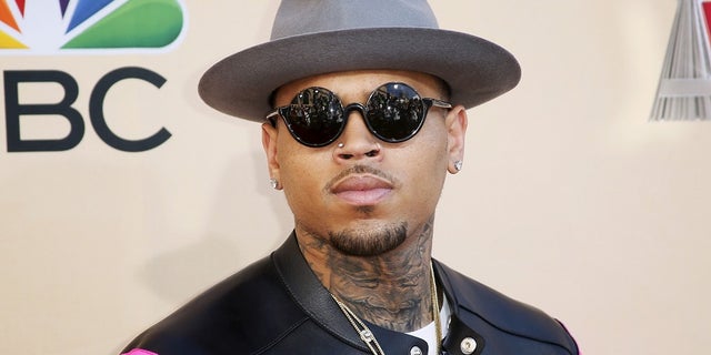 Singer Chris Brown poses at the 2015 iHeartRadio Music Awards in Los Angeles, California, March 29, 2015. REUTERS/Danny Moloshok - RTR4VEB6