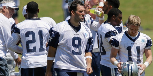 Dallas Cowboys quarterback Tony Romo (9) takes a break during an NFL football organized activity, Wednesday, June 10, 2015, in Irving, Texas. (AP Photo/Tim Sharp)