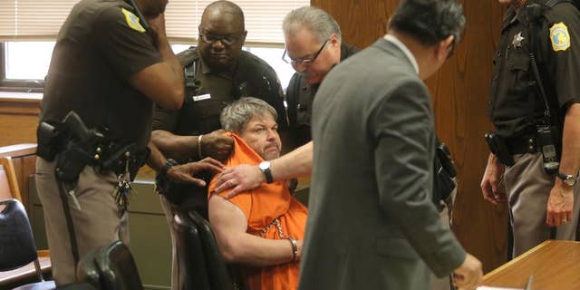 Kalamazoo County Deputies try to remove Jason Dalton after an outburst during his preliminary examination in district court on Friday, May 20, 2016 in Kalamazoo, Mich. Prosecutors say Dalton gunned down six people and wounded two others in the Kalamazoo area over several hours on Feb. 20 while driving for Uber that night. ( Mark Bugnaski/Kalamazoo Gazette-MLive Media Group via AP, Pool)