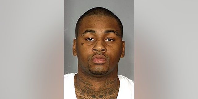 FILE - This image provided by the Las Vegas Metropolitan Police Department shows Ammar Harris in a booking photo from a 2012 arrest in Las Vegas. Harris, a self-described pimp has been indicted on charges that could bring the death penalty in a fatal shooting and fiery crash that killed three people on the Las Vegas Strip. The Clark County District Court grand jury also handed up a surprise indictment Friday April 26, 2013,  against 27-year-old Harris. It stems from a 2010 case and charges him with robbery and felony sex assault. (AP Photo/Las Vegas Metropolitan Police Department, File)