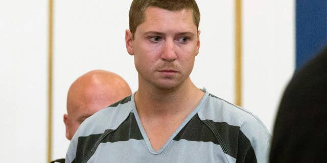 FILE - In this July 30, 2015 file photo, former University of Cincinnati police officer Ray Tensing appears at Hamilton County Courthouse for his arraignment in the in the July 19 shooting death of motorist Samuel DuBose in Cincinnati. An attorney for Tensing filed a request Wednesday, Aug. 26, 2015, asking the court to move the trial elsewhere. Tensing pleaded not guilty to charges of murder and involuntary manslaughter. His trial is scheduled for Nov. 16. (AP Photo/John Minchillo, File)
