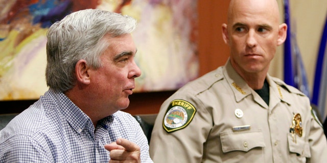 Nov. 1, 2010: Cochise County Sheriff Larry Dever, left, speaks about illegal immigration at an event in Arizona also attended by Pinal County Sheriff Paul Babeu.