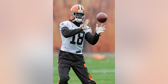 Cleveland Browns wide receiver Greg Little catches a pass during practice at the NFL football team's facility in Berea, Ohio Wednesday, Nov. 6, 2013. (AP Photo/Mark Duncan)