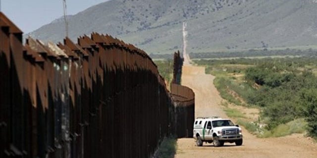A U.S. Customs and Border Patrol agent patrols along the Arizona-Mexico border Aug. 15 in Hereford, Ariz. (AP Photo)