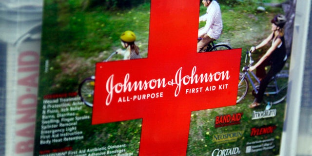 A first aid kit made by Johnson & Johnson for sale on a store shelf in Westminster, Colorado April 14, 2009. Johnson & Johnson said its quarterly earnings fell, hurt by generic competition for its Risperdal schizophrenia drug and the strong dollar, but lower costs enabled the company to beat Wall Street expectations. REUTERS/Rick Wilking (UNITED STATES BUSINESS) - RTXDZJN