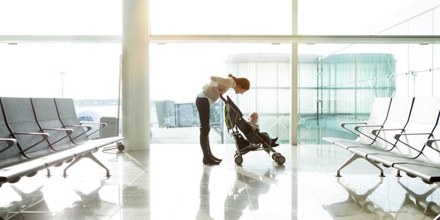 Mother with baby at the airport