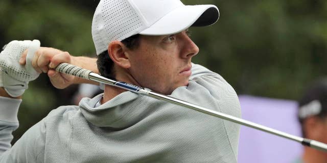 FILE - In this Thursday, Oct. 27, 2016 file photo, Rory McIlroy of Northern Ireland hits a tee shot during the WGC-HSBC Champions golf tournament at the Sheshan International Golf Club in Shanghai, China. Rory McIlroy made an impressive start to 2017 with a new set of clubs, shooting a 5-under 67 in the first round at the SA Open on Thursday, Jan. 12, 2017. Making his first appearance at the tournament since 2008, McIlroy rolled in seven birdies - including four straight from Nos. 14-17 after starting at the 10th - to lie a shot off the lead held by Trevor Fisher Jr. after the morning starters. (AP Photo/Ng Han Guan, file)