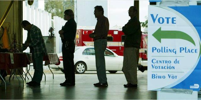 FILE - In this Jan. 29, 2008 file photo, voters line up at a polling station to vote in Florida's presidential primary in Coral Gables, Fla. A Florida commission is expected to announce Friday, Sept. 30, 2011, that its presidential primary will be held Jan. 31, according to Florida House Speaker Dean Cannon, though GOP officials from other states are lobbying Florida to reconsider. (AP Photo/Wilfredo Lee, File)