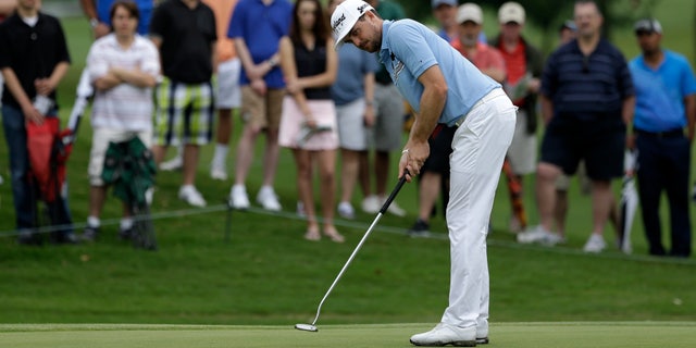 Keegan Bradley watches his birdie putt on the second green during the first round of the Byron Nelson Championship golf tournament Thursday, May 16, 2013, in Irving, Texas. Bradley finished the day with course record 10-under par 60. (AP Photo/Tony Gutierrez)