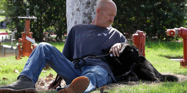 Oct. 6, 2012: Don Matyja, a homeless Army veteran poses for a picture with his dog Tyson at Lions park in Costa Mesa, Calif.