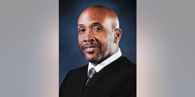 In this undated photo released by the Maryland Judiciary Office of Communications and Public Affairs, Baltimore Circuit Judge Barry Williams poses for a photo. Judge Williams who's overseeing the emotionally charged case of a young black man who died in police custody is a former federal prosecutor who used to put dirty police officers on trial. Friends and colleagues describe Baltimore Circuit Judge Williams as an even-handed judge who has a sense of humor but doesn’t tolerate any courtroom grandstanding. People on both sides of the Freddie Gray case agree that he is the best judge for the job.(Maryland Judiciary Office of Communications and Public Affairs via AP)