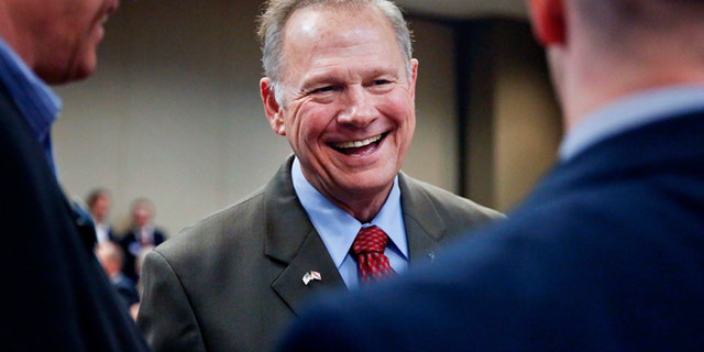 Former Alabama Chief Justice and U.S. Senate candidate Roy Moore, talks to constituents before a Republican Senate candidate forum, Friday, Aug. 4, 2017, in Pelham, Ala. (AP Photo/Brynn Anderson)