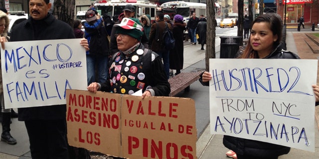 A group of demonstrators outside the Jacob K. Javits Federal Office Building in Lower Manhattan, New York on Wednesday Dec. 3, 2014