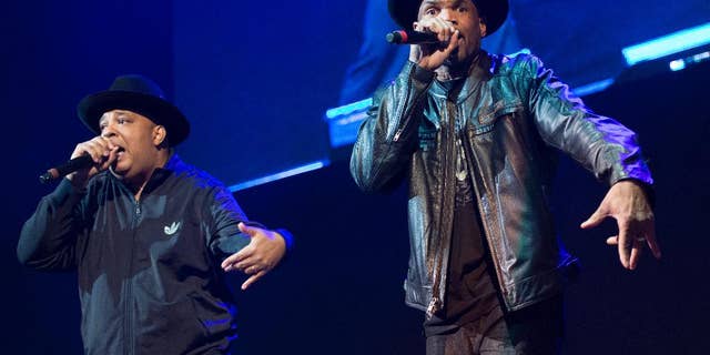 FILE - In this Dec. 19, 2014 file photo, Joseph Simmons, left, and Darryl McDaniels of Run DMC perform at Christmas in Brooklyn at the Barclays Center in the Brooklyn borough of New York. Run DMC is expected to open for the Red Hot Chili Peppers at the sixth-annual DirecTV Super Saturday Night concert in San Francisco the night before the Super Bowl. (Photo by Scott Roth/Invision/AP, File)