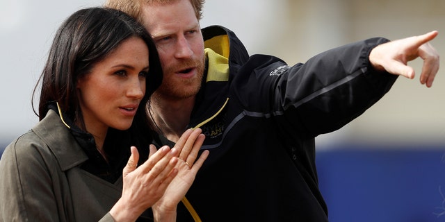 Britain's Prince Harry, Patron of the Invictus Games Foundation, and Meghan Markle watch athletes at the team trials for the Invictus Games Sydney 2018 at the University of Bath Sports Training Village in Bath, Britain, April 6, 2018.