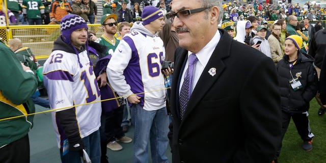 FILE - In this Dec. 2, 2012, file photo, Minnesota Vikings owner Zygi Wilf makes his way to the field before an NFL football game against the Green Bay Packers in Green Bay, Wis. He may not be Jerry Jones, but his approach is doing wonders for the Vikings as they head back to the playoffs, (AP Photo/Morry Gash, File)