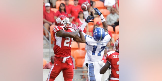 Memphis' Chris Morley, right, breaks up pass intended for Houston' Markeith Ambles, left, during the second quarter of an NCAA college football game at BBVA Compass Stadium Saturday, Oct. 12, 2013, in Houston. (AP Photo/Houston Chronicle, Melissa Phillip)